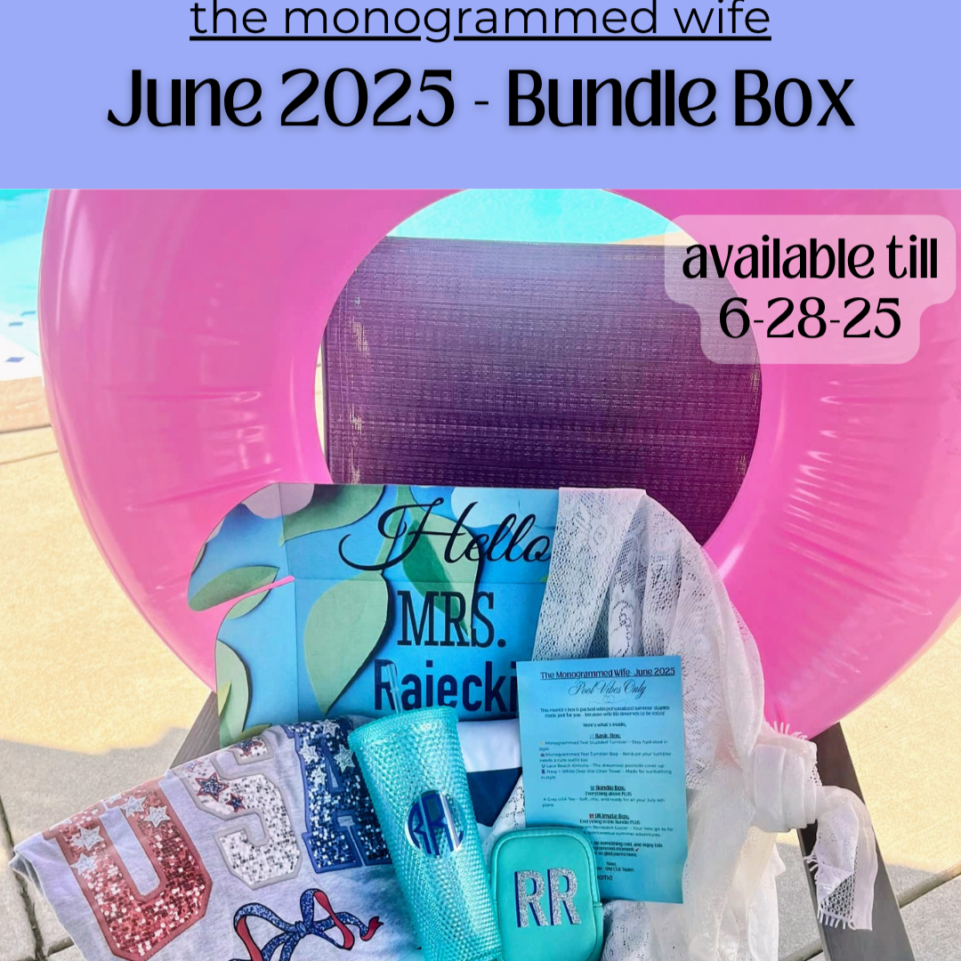 une 2025 Monogrammed Wife Bundle Box featuring a sequin USA T-shirt, blue monogrammed tumbler, matching tumbler pouch, striped lounge chair cover, lace sarong, and printed insert, all displayed with a pink pool float in the background.