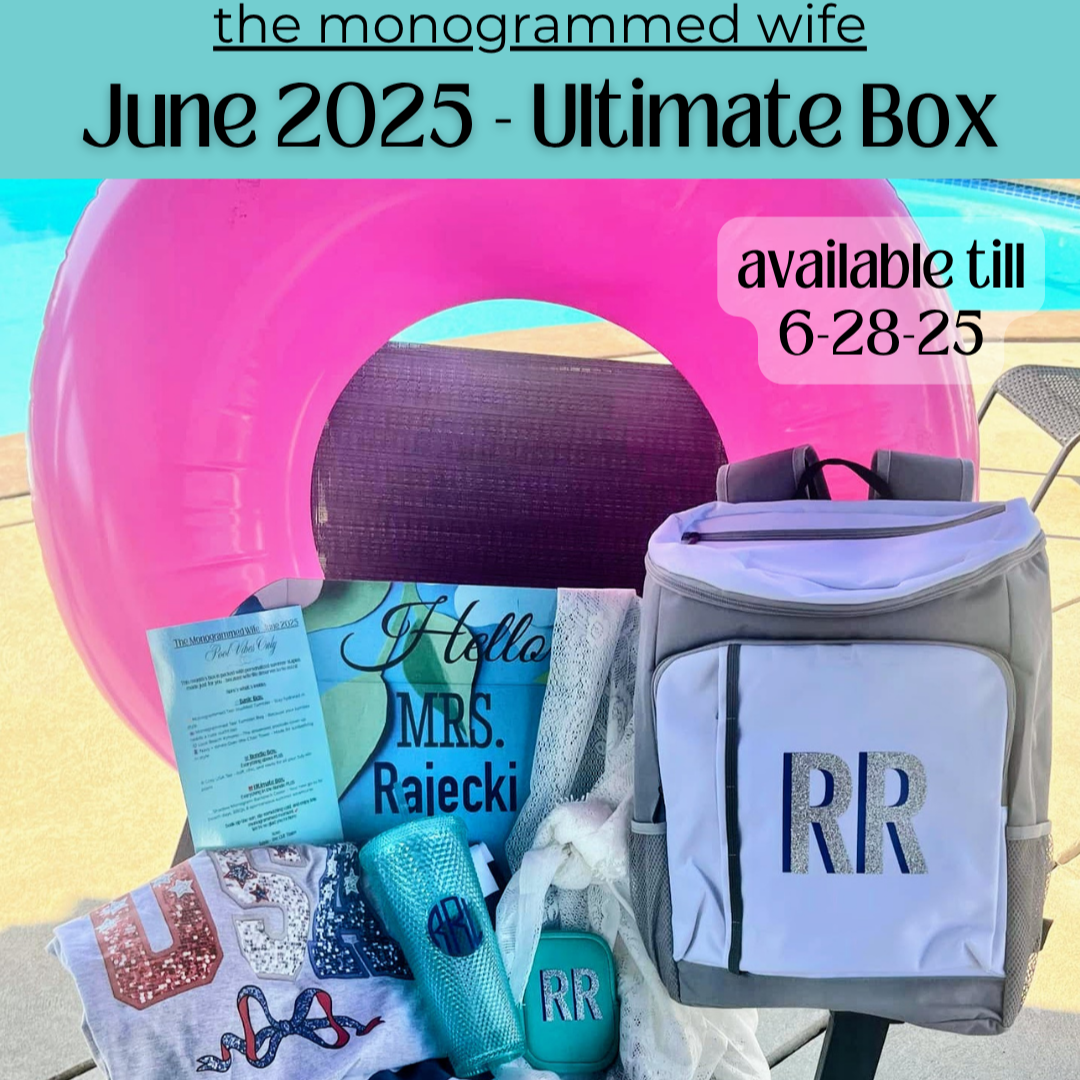 June 2025 Monogrammed Wife Ultimate Box featuring a USA sequin T-shirt, blue monogrammed tumbler and pouch, striped lounge chair cover, lace sarong, custom monogrammed backpack, and printed insert, all displayed poolside with a pink float in the background.