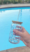 Clear 16oz glass cup with bamboo lid and straw featuring a blue bow pattern, perfect for iced coffee and bridal gifts.