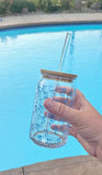 Clear 16oz glass cup with bamboo lid and straw featuring a blue bow pattern, perfect for iced coffee and bridal gifts.