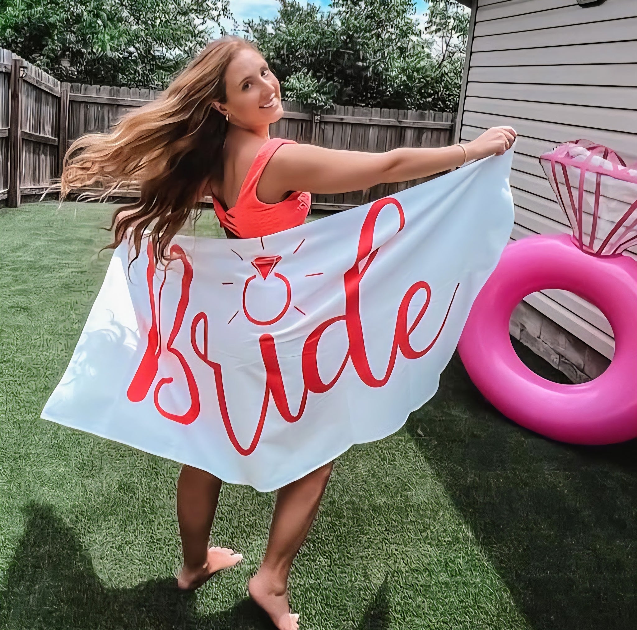 White microfiber towel with bold pink 'Bride' lettering and diamond ring graphic.