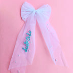 Embroidered Bride To Be hair bow with attached veil clip for bachelorette parties and bridal events.
