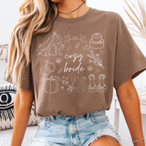 Cozy Bride and Cozy Wife fall graphic t-shirts in soft cotton, perfect for brides and wives to celebrate autumn, wedding planning, and wife life.