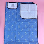 Foldable picnic mat with blue engagement ring print, white inner lining, and personalized flap—perfect for brides, wives, or bridal party outings.