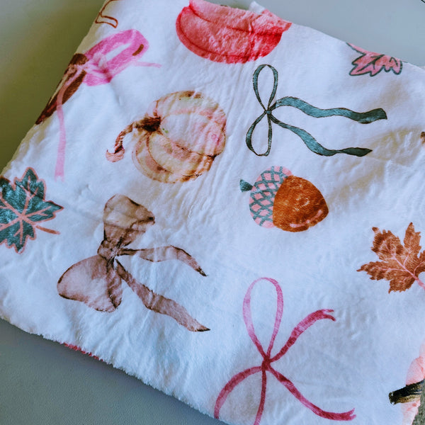 Cozy fall-themed blanket in neutral autumn tones, perfect for brides and wives. Ultra-soft material, generous size for cuddling, featuring a bride and wife inspired design. Ideal for chilly nights, autumn adventures, or gifting to newlyweds.