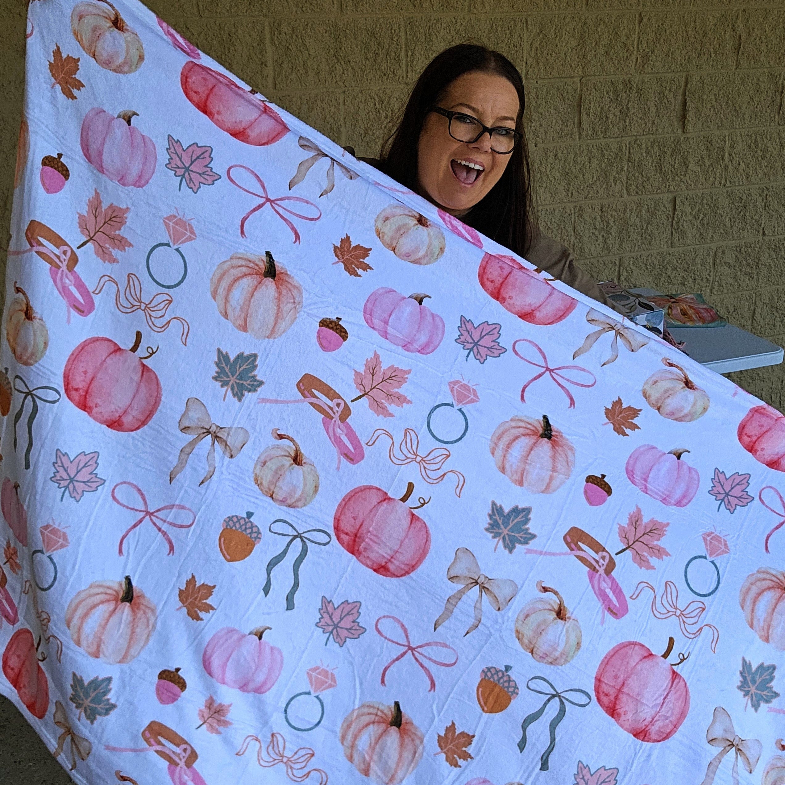 Cozy fall-themed blanket in neutral autumn tones, perfect for brides and wives. Ultra-soft material, generous size for cuddling, featuring a bride and wife inspired design. Ideal for chilly nights, autumn adventures, or gifting to newlyweds.