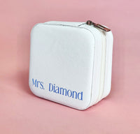 White personalized travel jewelry case open to display organized earrings, rings, and necklaces; compact design perfect for brides and travel.