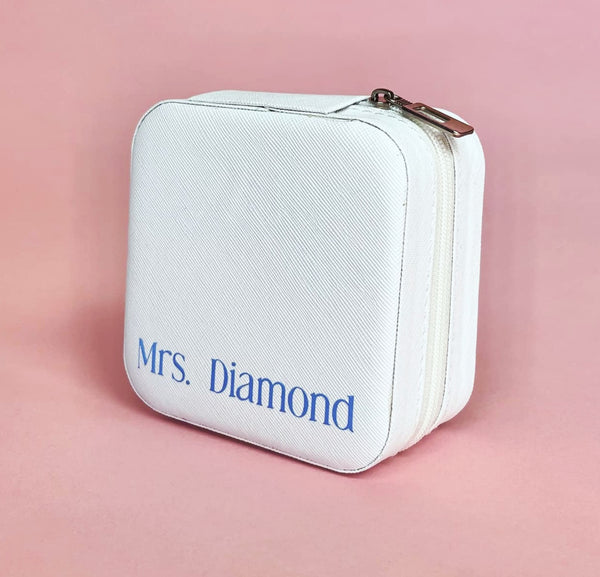 White personalized travel jewelry case open to display organized earrings, rings, and necklaces; compact design perfect for brides and travel.