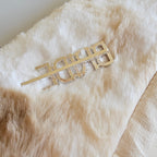 Gold decorative hairpin on a fur surface