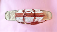 White and brown foldable weekender travel bag with leather-style straps, perfect for brides on the go.