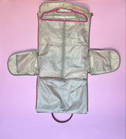 White and brown foldable weekender travel bag with leather-style straps, perfect for brides on the go.