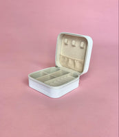 White personalized travel jewelry case open to display organized earrings, rings, and necklaces; compact design perfect for brides and travel.