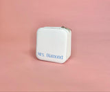 White personalized travel jewelry case open to display organized earrings, rings, and necklaces; compact design perfect for brides and travel.
