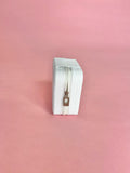 White personalized travel jewelry case open to display organized earrings, rings, and necklaces; compact design perfect for brides and travel.