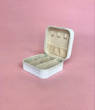 White personalized travel jewelry case open to display organized earrings, rings, and necklaces; compact design perfect for brides and travel.