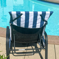 Navy and white striped lounge chair towel cover with side pockets, displayed poolside—perfect for brides and wives on honeymoon or summer getaways.
