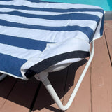 Navy and white striped lounge chair towel cover with side pockets, displayed poolside—perfect for brides and wives on honeymoon or summer getaways.