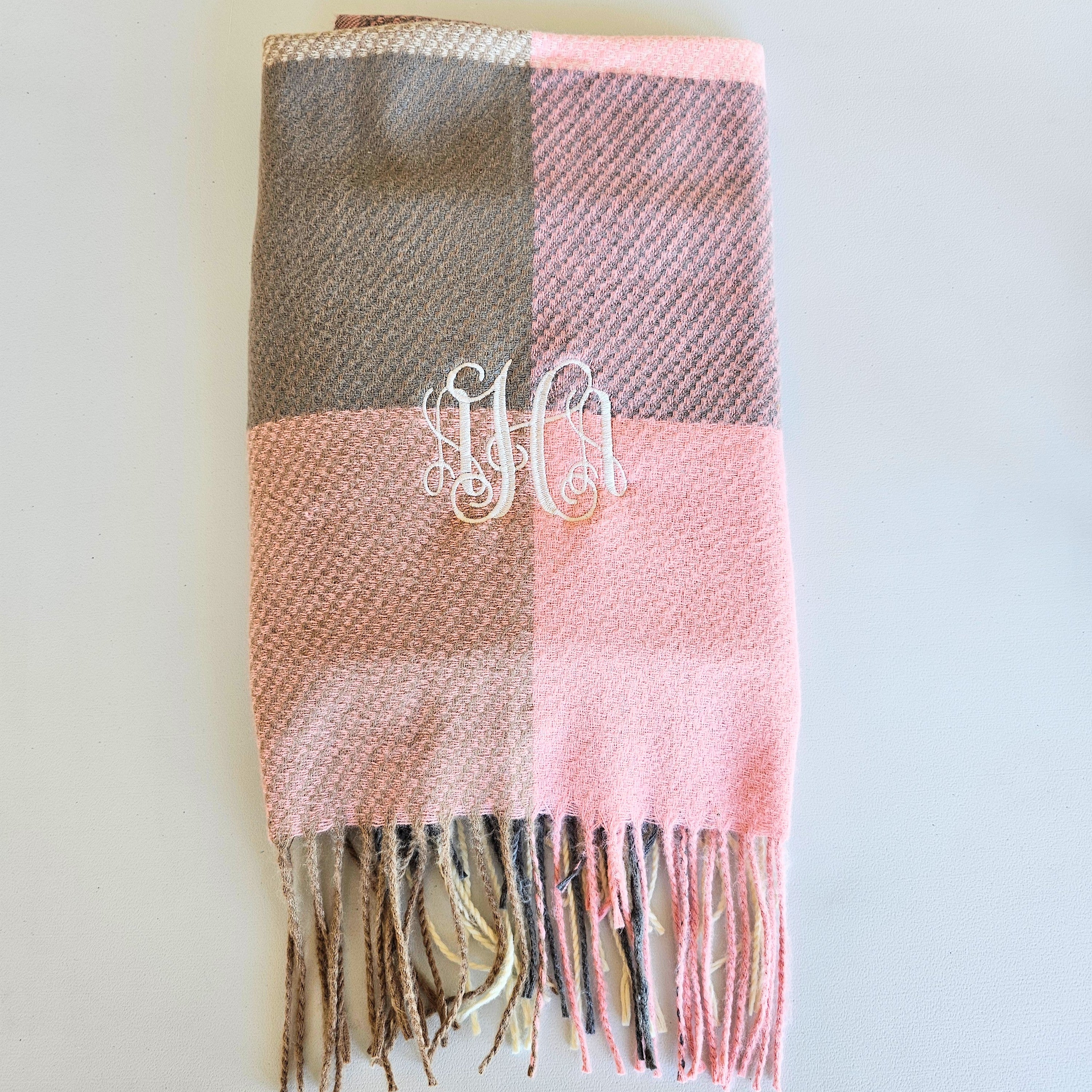 Fall plaid scarf in soft autumn tones with fringe edges, perfect cozy accessory for brides and wives to stay warm and stylish in the season.