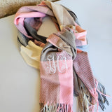 Fall plaid scarf in soft autumn tones with fringe edges, perfect cozy accessory for brides and wives to stay warm and stylish in the season.