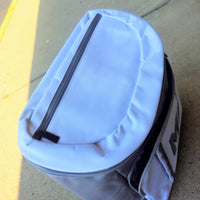 Gray and white monogrammed cooler backpack with glitter initials, featuring insulated compartments and mesh side pockets, perfect for brides and wives.
