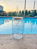 Clear glass cup with bamboo lid and straw featuring blue “She’s Tying the Knot” text and wedding doodles, perfect for brides and iced coffee lovers.
