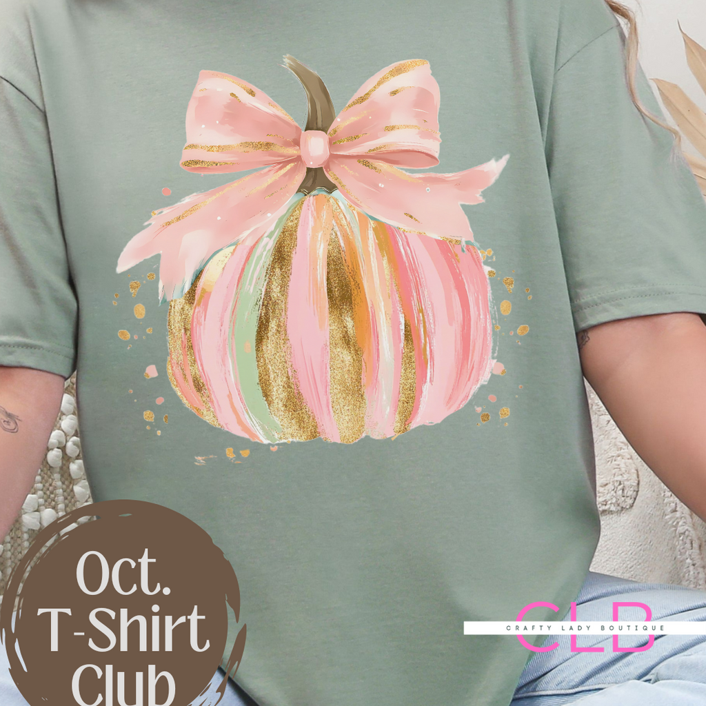 ✨ Celebrate fall in style with our hand-painted pink pumpkin bow tee 🎃🎀 Perfect for brides & wives who love cozy, artistic fashion!