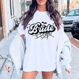 Halloween bride sweatshirt, Halloween bride tee, spooky bride shirt, white bride sweatshirt, Halloween bridal apparel, bride shirt with spiderwebs and bats, Halloween wedding top, spooky bride collection, Halloween-themed bridal wear, bride t-shirt for Halloween, fall bride shirts