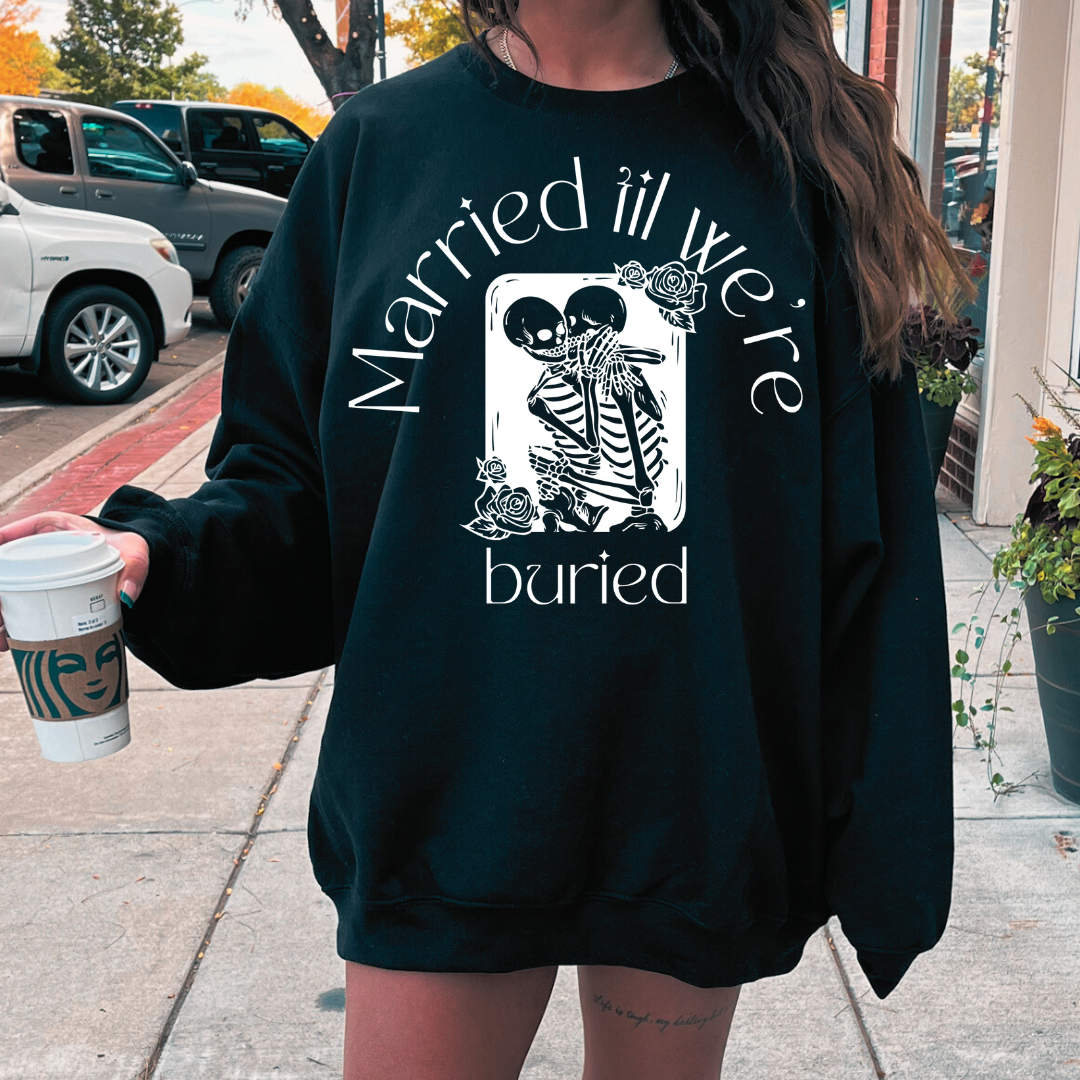 Married Til We're Buried tee, black bride sweatshirt, Halloween bride shirt, skeleton bride design, black bridal apparel, spooky bride collection, eternal love skeleton shirt, Halloween wedding top, black bride accessories, Halloween-themed bridal wear, black bridal party outfit