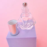 Mini glass roller ball perfume bottle with silver lid, perfect for wedding day fragrance and on-the-go bridal touch-ups