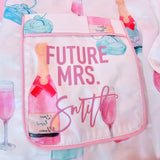 White and pink bridal pajamas with champagne and ring design, ideal for wedding morning, engagement season, and bridal photos